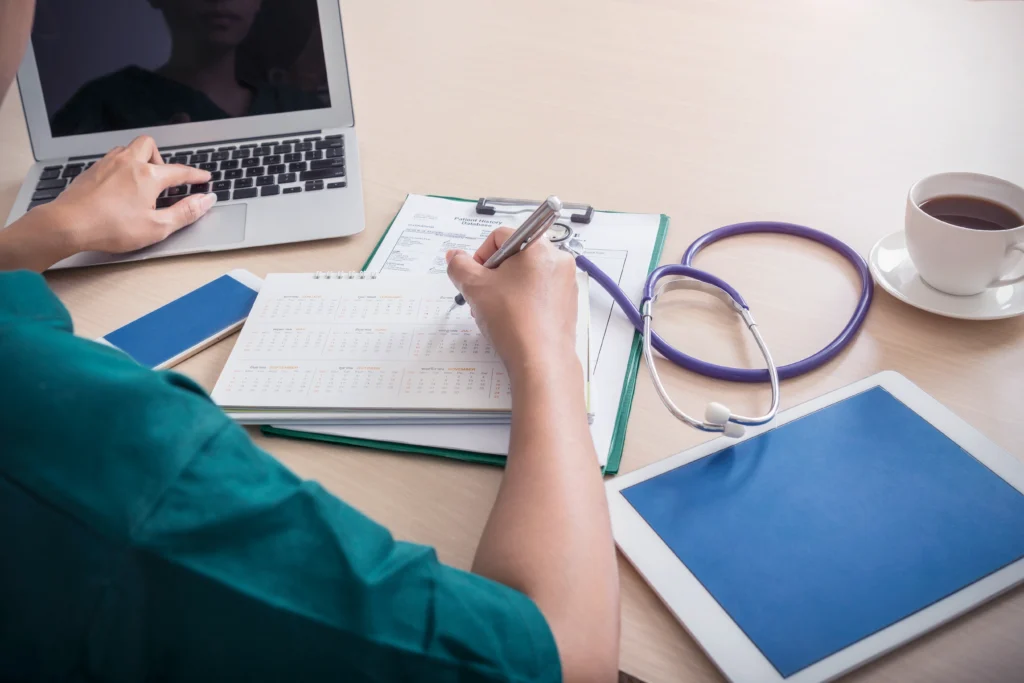 healthcare-medical-concept-doctor-working-with-laptop-mobile-tablet-stethoscope-c