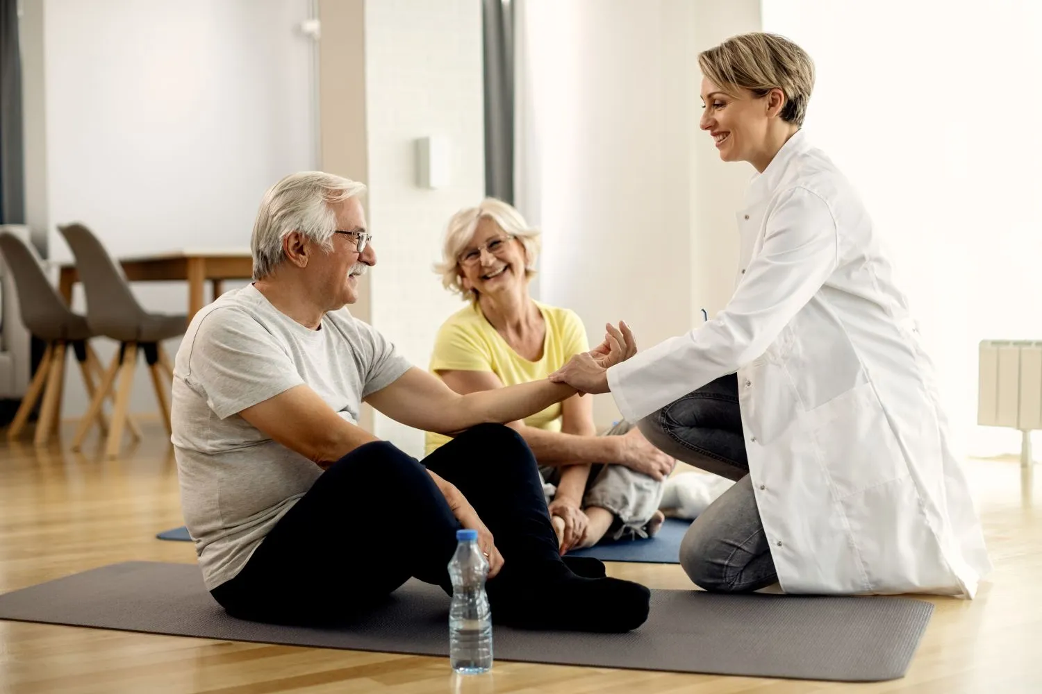 Senior wellness programs instructor supporting seniors